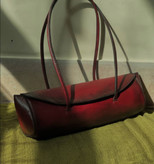 "Women's luxury leather bag, hand-stitched cowhide, patina finish, caramel color